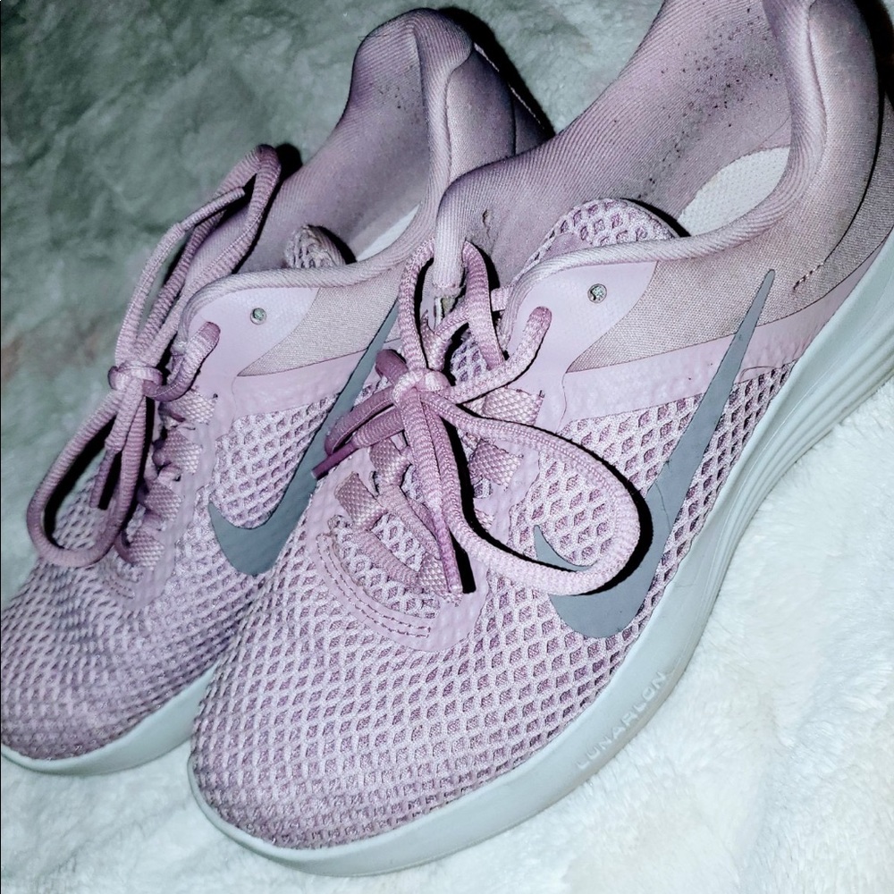 Mauve pink Nike tennis shoes